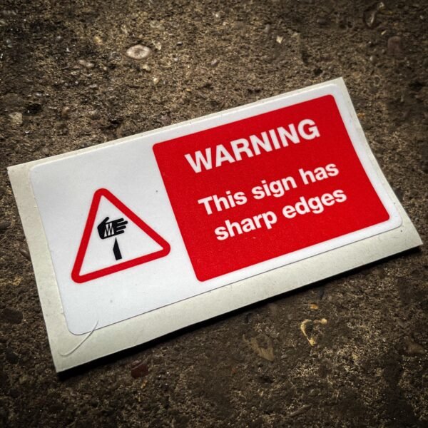 Funny "safety" sticker - WARNING: This sign has sharp edges